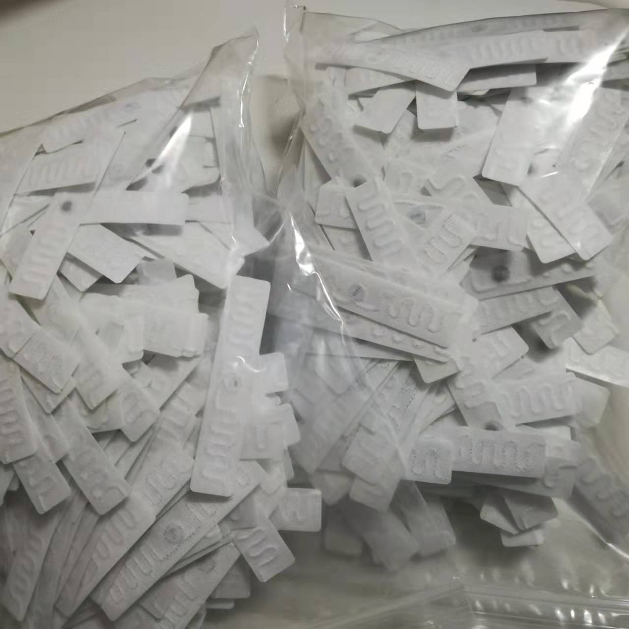 Etykieta do prania tekstyliów UHF RFID z kodem NXP ucode 8