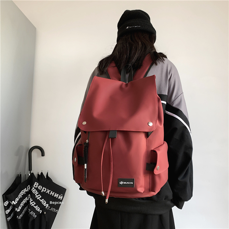 潮酷男女款双肩背包批发防泼水机车大容量大盖学生书包新款双肩包