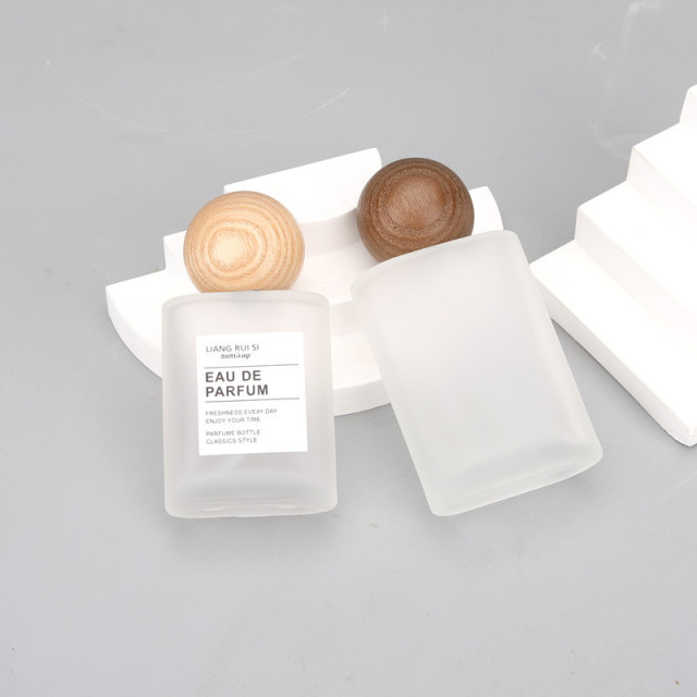 30ml 50ml frosted oval glass bottle with mist sprayer and  wooden ball cap