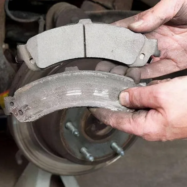 Symptoms of sticking brake calipers such as uneven pad wear and overheating
