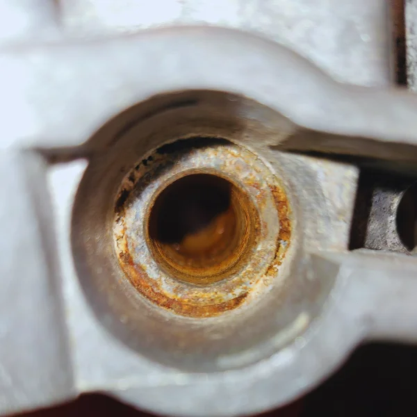 Causes of sticking brake calipers including corrosion and seized slide pins