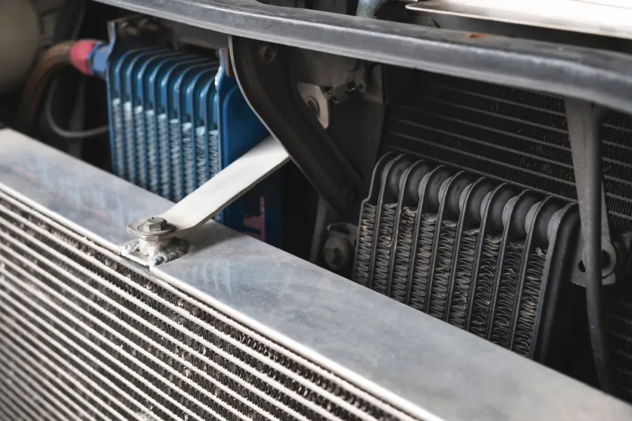 What is the normal engine oil temperature and how an engine oil cooler controls heat
