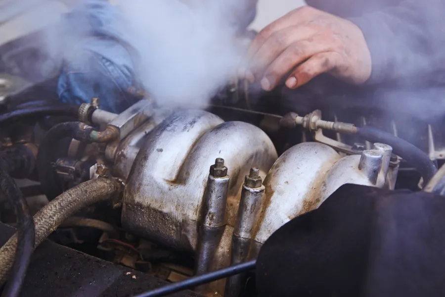 Reasons Why a Car Is Leaking Oil and How to Fix It &ndash; burnt oil smell and smoke from engine bay