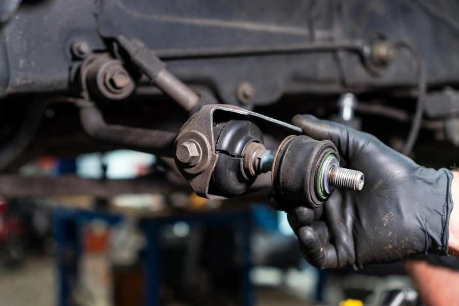 Worn control arm bushing showing suspension noise and early Signs of Suspension Problems