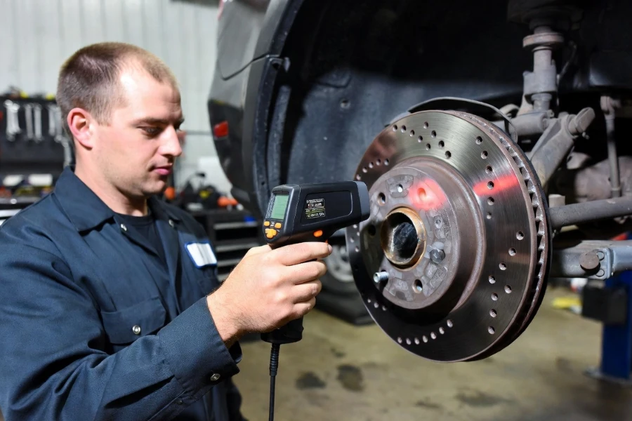 Why Are My Brakes Overheating diagnosed using infrared thermometer on brake rotor