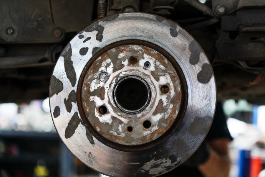 uneven brake pad deposits causing brake vibration and rotor hot spots