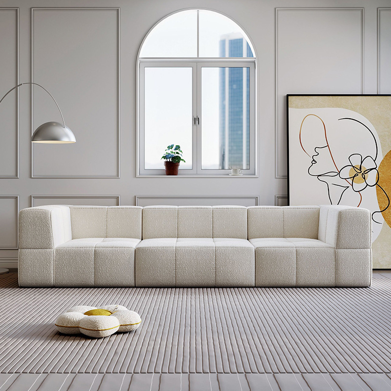 Sofá esquinero reclinable de tela de cuero nórdico simple fabricado en China, con sistema de compresión al vacío, ideal para comedor. Cama de terciopelo Teddy color crema con diseño de bloques de algodón de azúcar.