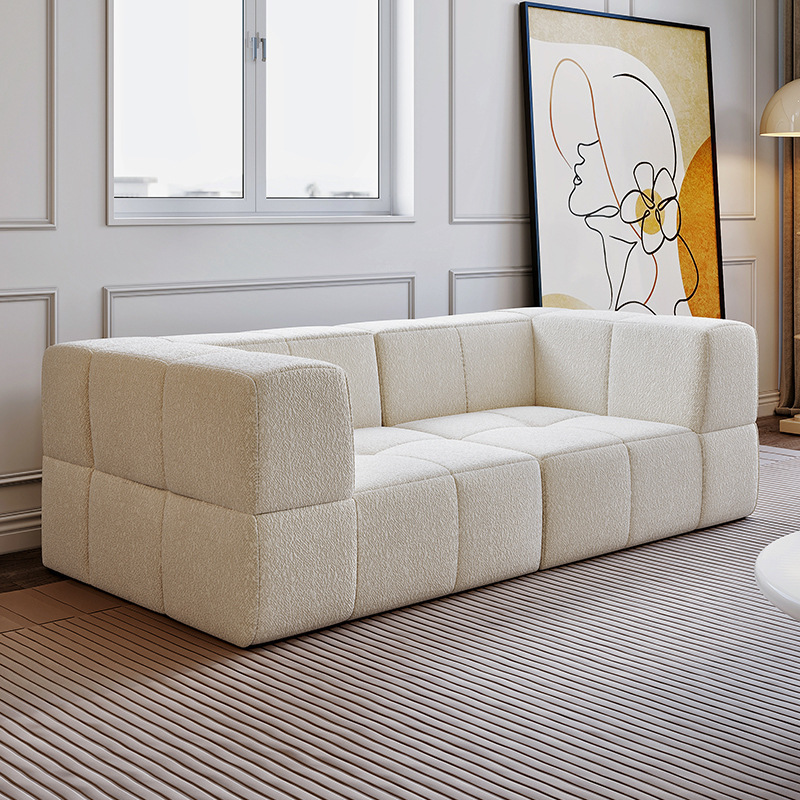 Sofá esquinero reclinable de tela de cuero nórdico simple fabricado en China, con sistema de compresión al vacío, ideal para comedor. Cama de terciopelo Teddy color crema con diseño de bloques de algodón de azúcar.