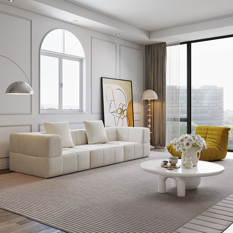 Sofá esquinero reclinable de tela de cuero nórdico simple fabricado en China, con sistema de compresión al vacío, ideal para comedor. Cama de terciopelo Teddy color crema con diseño de bloques de algodón de azúcar.