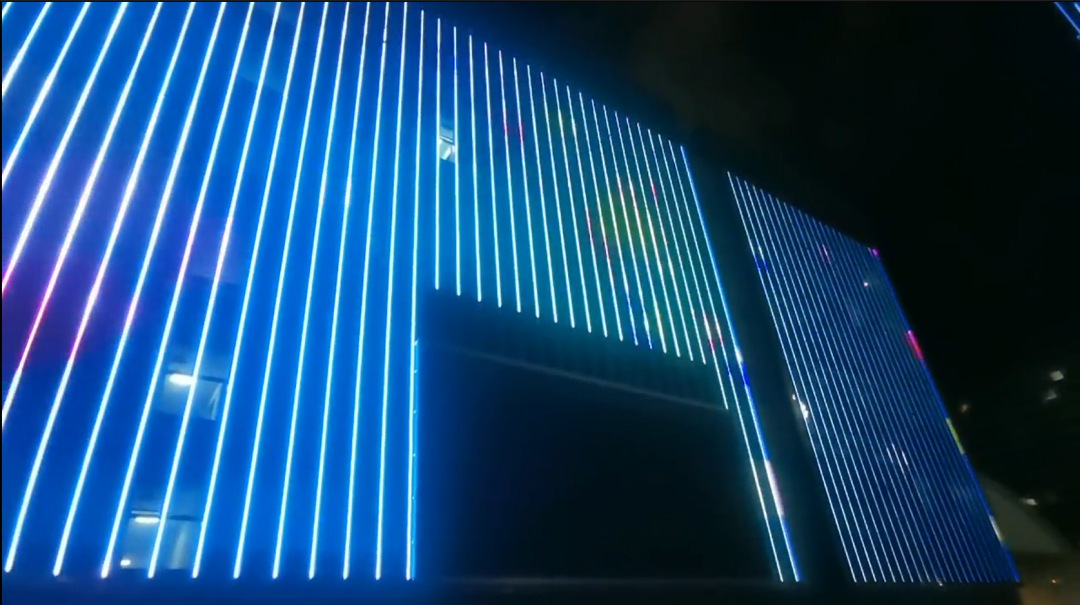 Building facade linear LED display for urban lighting