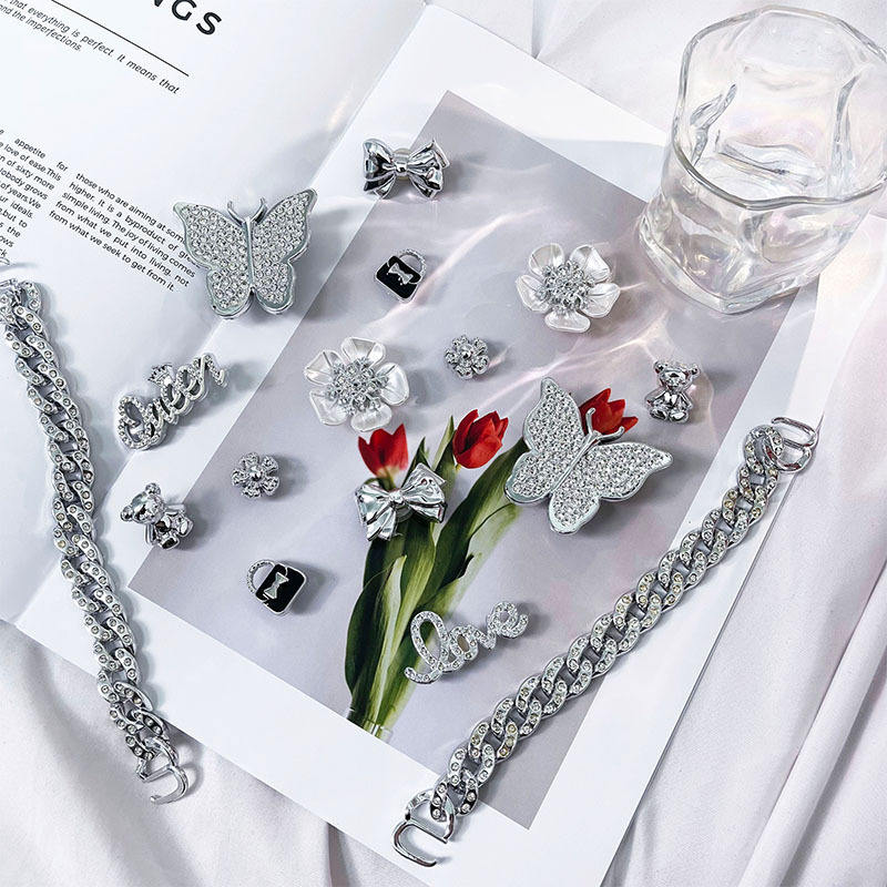 Lifestyle flat lay of crystal word charms on magazine