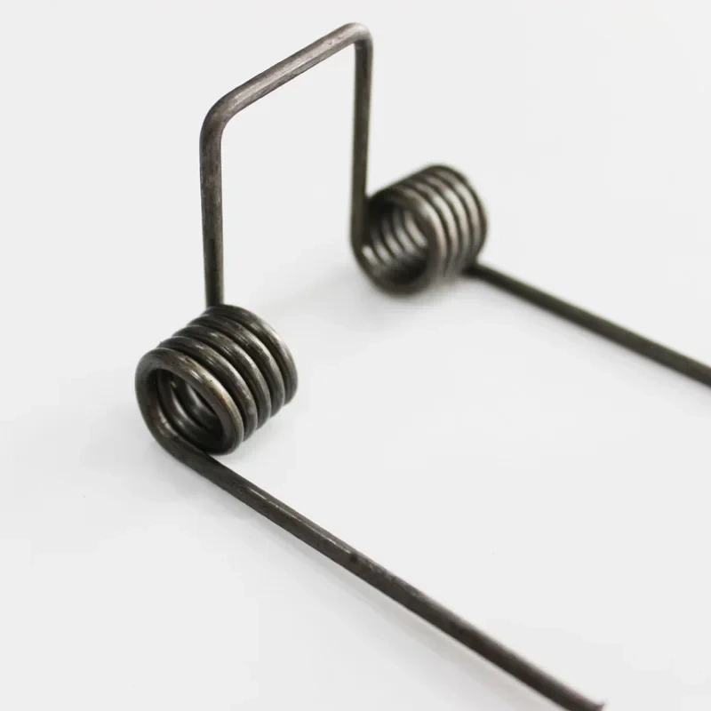 Double torsion spring,wire dia 2.5mm OD. 15.5mm feet length 65mm 5 coils
