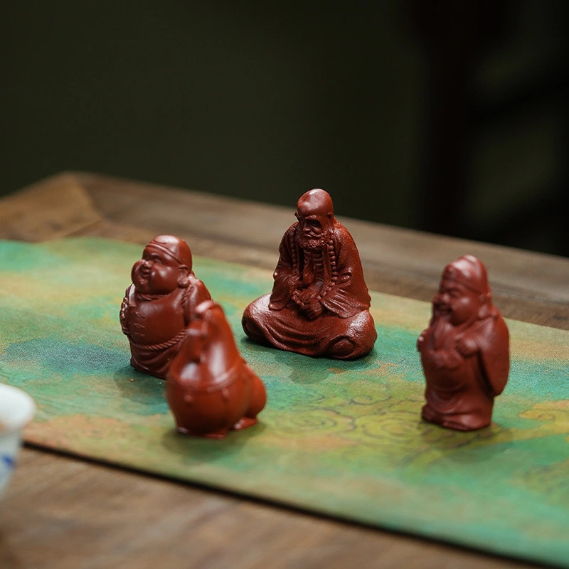 Made of purple clay, it is a collectible for tea - drinking occasions. The figurines of the God of Longevity and the God of Wealth can bring health, longevity and wealth.