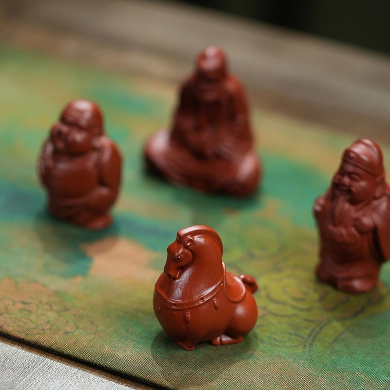 Made of purple clay, it is a collectible for tea - drinking occasions. The figurines of the God of Longevity and the God of Wealth can bring health, longevity and wealth.