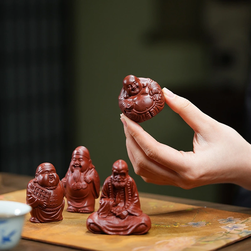 Made of purple clay, it is a collectible for tea - drinking occasions. The figurines of the God of Longevity and the God of Wealth can bring health, longevity and wealth.