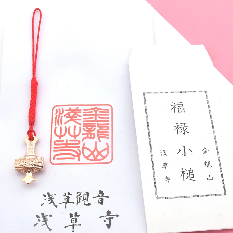 The amulet from Sensoji Temple, a hammer that can bring good luck.