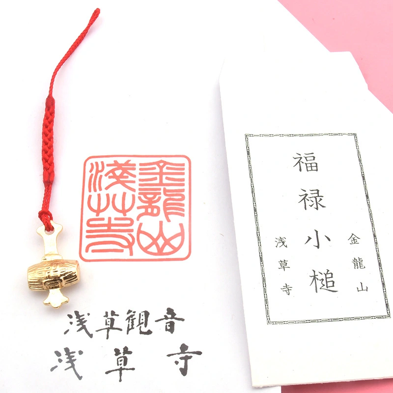 The amulet from Sensoji Temple, a hammer that can bring good luck.