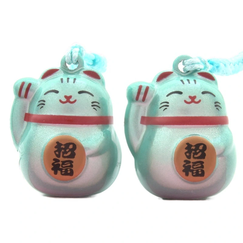 The Maneki-neko Water Sound Bell Omamori for Good Luck and Wealth Attraction from Sensoji Temple in Japan. (Here, "Maneki-neko" is the Japanese name for the beckoning cat, which is often associated with attracting good fortune and wealth in Japanese cultu