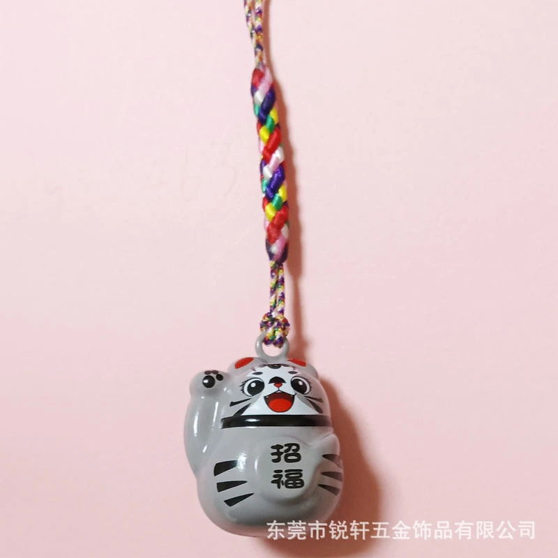 The Maneki-neko Water Sound Bell Omamori for Good Luck and Wealth Attraction from Sensoji Temple in Japan. (Here, "Maneki-neko" is the Japanese name for the beckoning cat, which is often associated with attracting good fortune and wealth in Japanese cultu