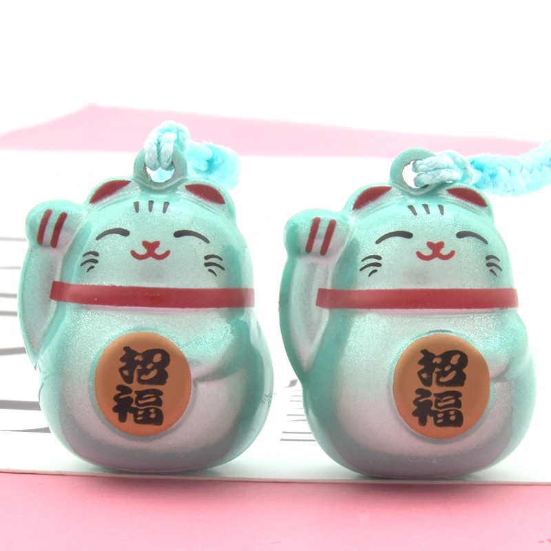 The Maneki-neko Water Sound Bell Omamori for Good Luck and Wealth Attraction from Sensoji Temple in Japan. (Here, "Maneki-neko" is the Japanese name for the beckoning cat, which is often associated with attracting good fortune and wealth in Japanese cultu