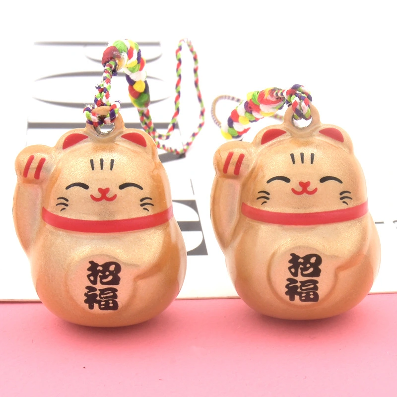The Maneki-neko Water Sound Bell Omamori for Good Luck and Wealth Attraction from Sensoji Temple in Japan. (Here, "Maneki-neko" is the Japanese name for the beckoning cat, which is often associated with attracting good fortune and wealth in Japanese cultu