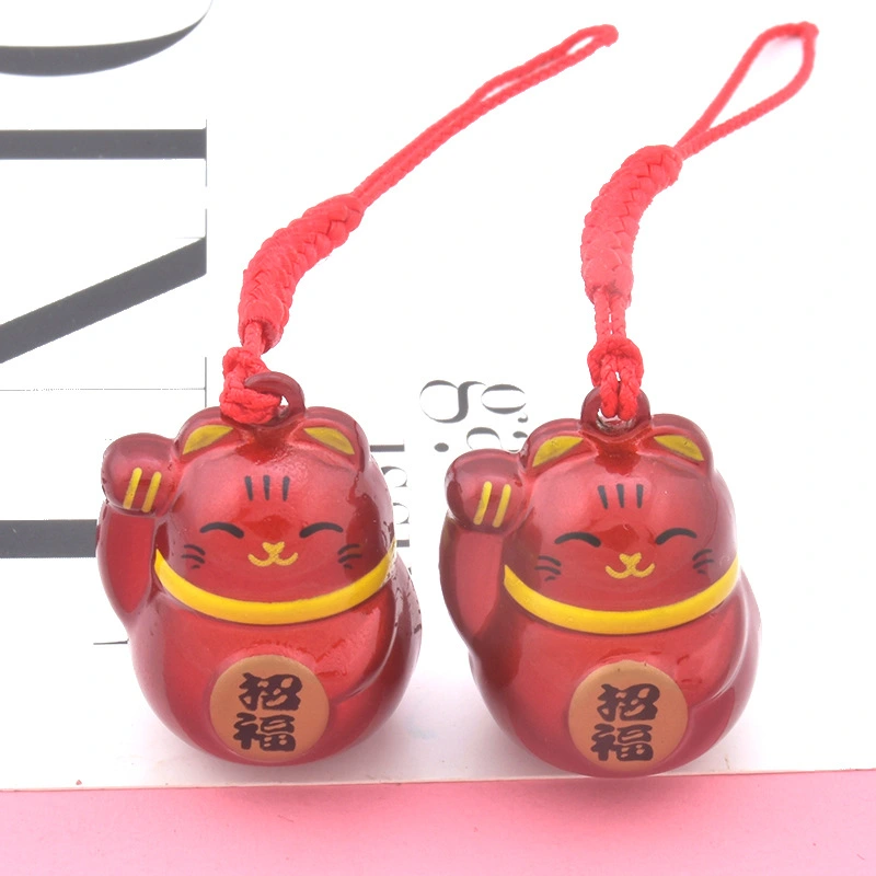 The Maneki-neko Water Sound Bell Omamori for Good Luck and Wealth Attraction from Sensoji Temple in Japan. (Here, "Maneki-neko" is the Japanese name for the beckoning cat, which is often associated with attracting good fortune and wealth in Japanese cultu