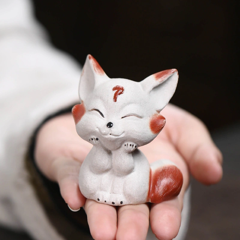A handmade fox ornament made from pure purple clay ore. It is believed to have the power to bring happiness and attract love.