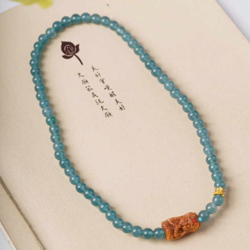 The female God of Wealth from Tibet, China, when paired with blue jadeite, can attract wealth, protect energy and help one relax inwardly.