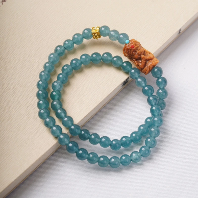 The female God of Wealth from Tibet, China, when paired with blue jadeite, can attract wealth, protect energy and help one relax inwardly.