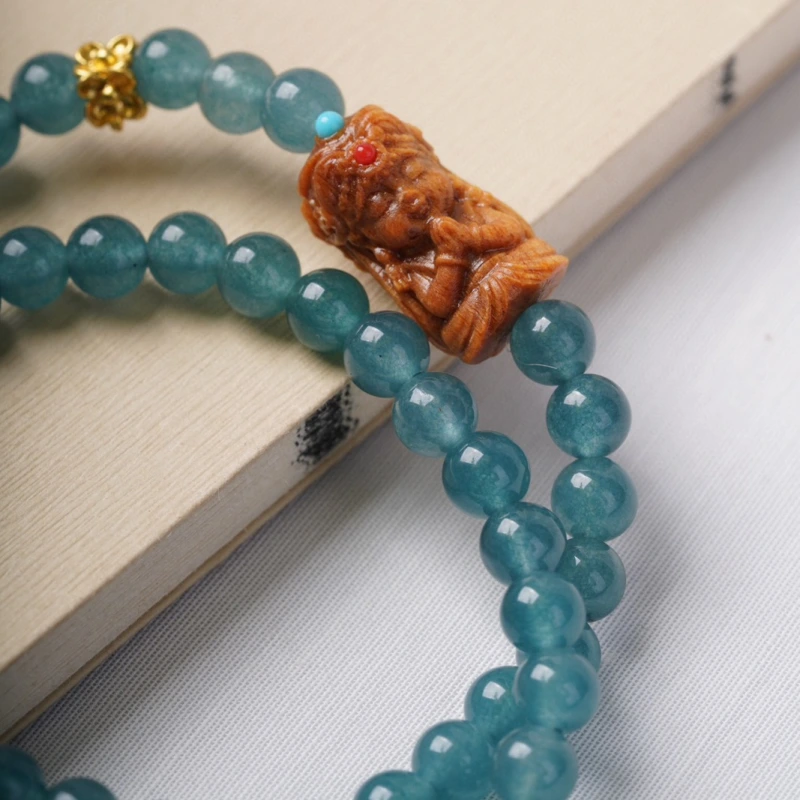 The female God of Wealth from Tibet, China, when paired with blue jadeite, can attract wealth, protect energy and help one relax inwardly.