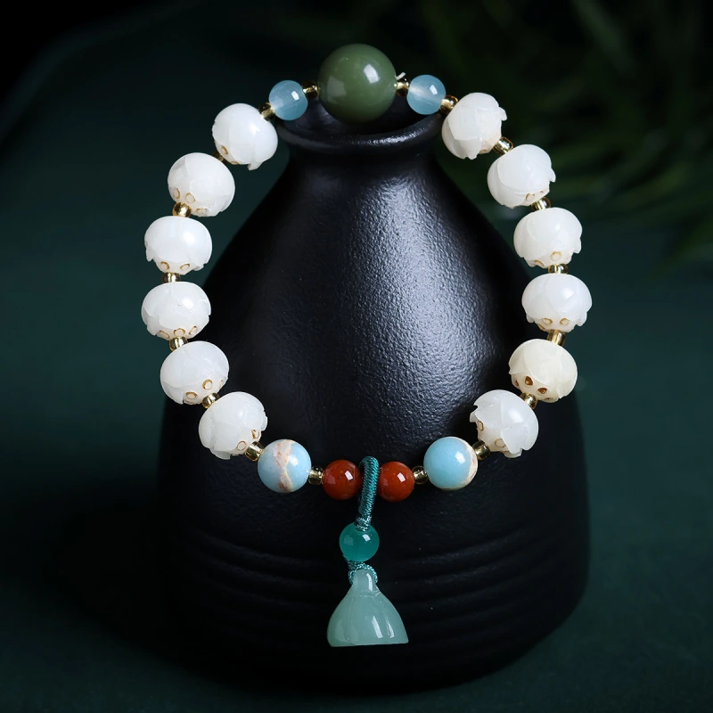 This purple glass bead bracelet comes from Chinese temples. It is believed to bring good luck, love and empower the wearer.