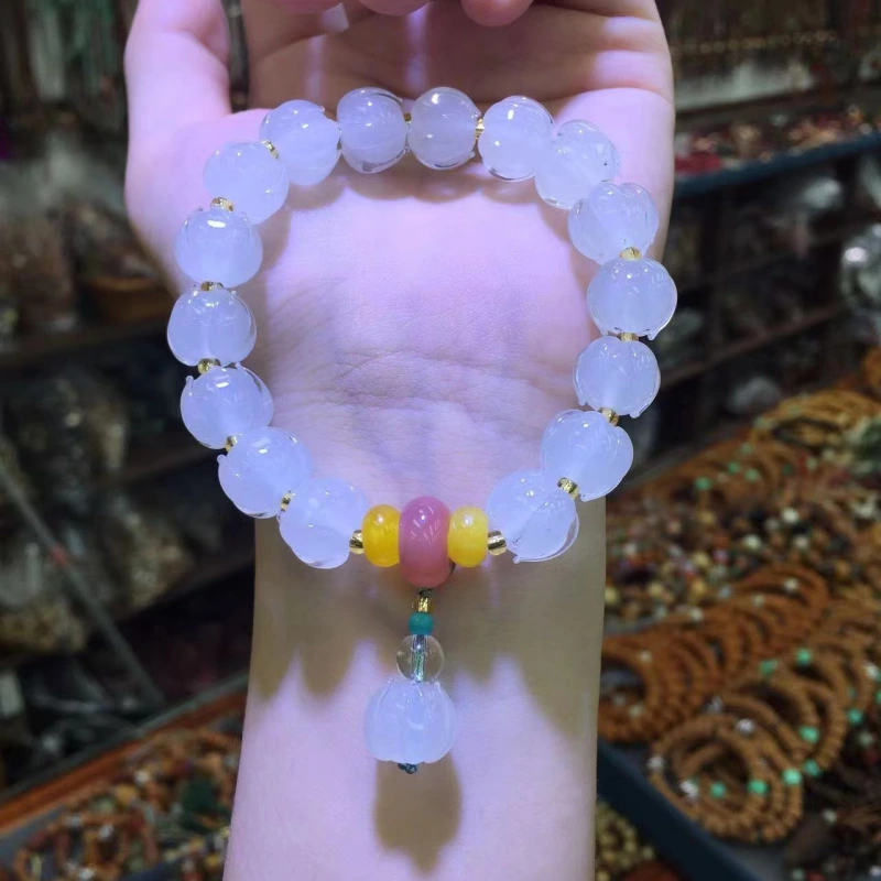 This purple glass bead bracelet comes from Chinese temples. It is believed to bring good luck, love and empower the wearer.