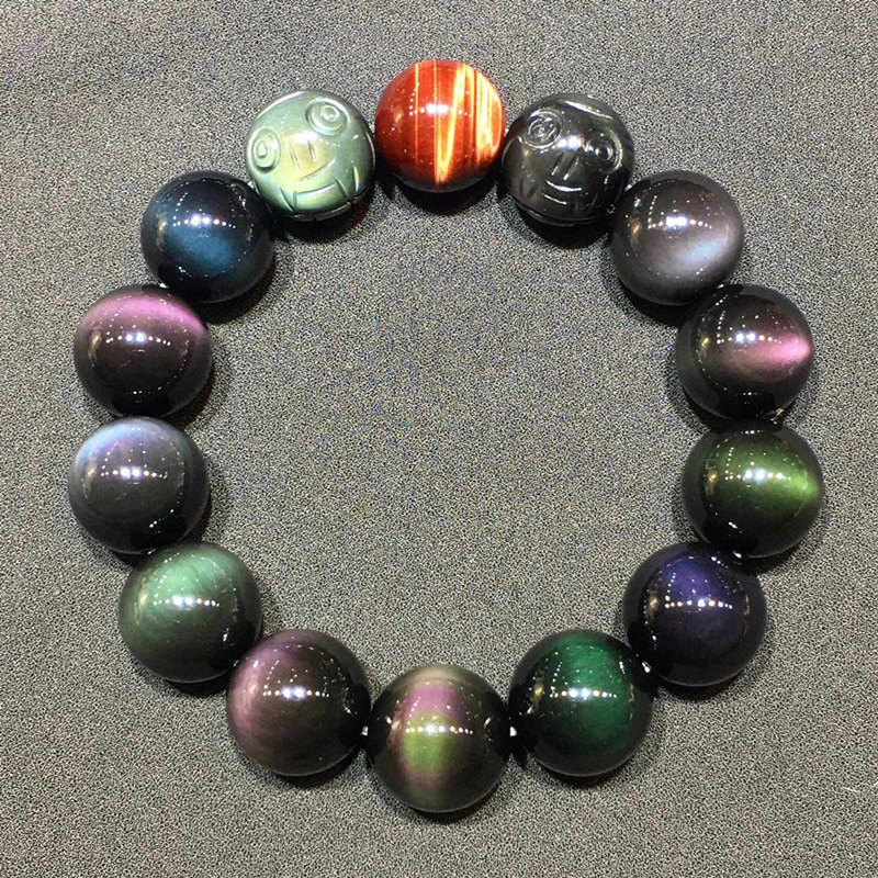 The natural obsidian, rainbow-colored cat's eye, and pixiu crystal bead bracelet have the implications of attracting wealth and treasures, enhancing fortune, promoting interpersonal relationships and safeguarding health.