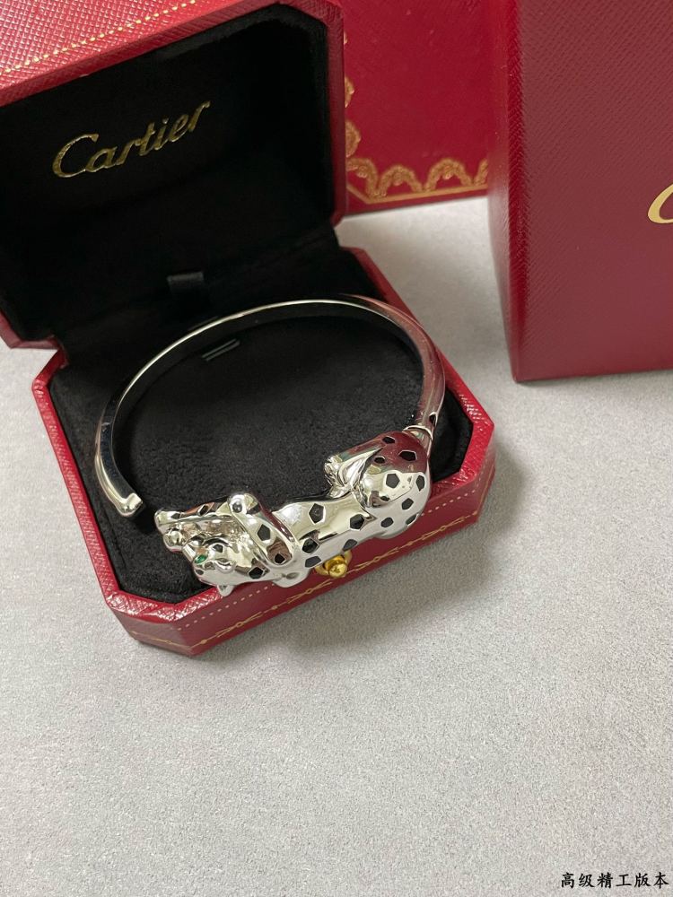 Cartier light gold spotted leopard bracelet.