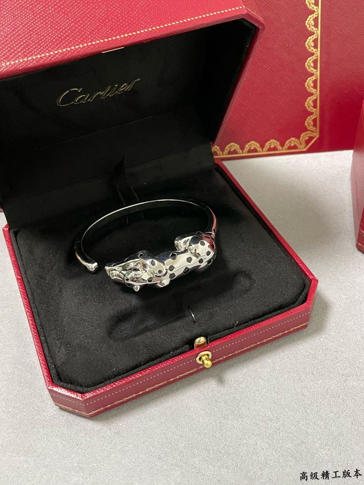 Cartier light gold spotted leopard bracelet.