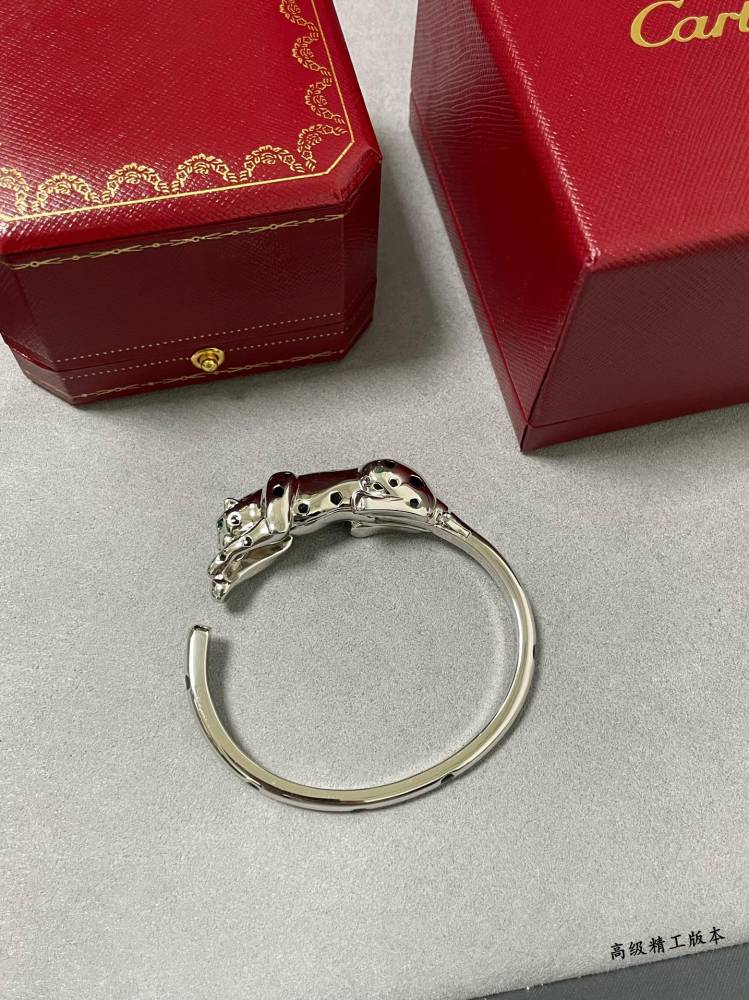 Cartier light gold spotted leopard bracelet.