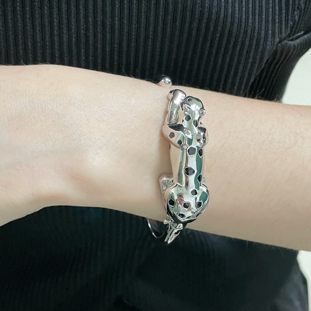 Cartier light gold spotted leopard bracelet.
