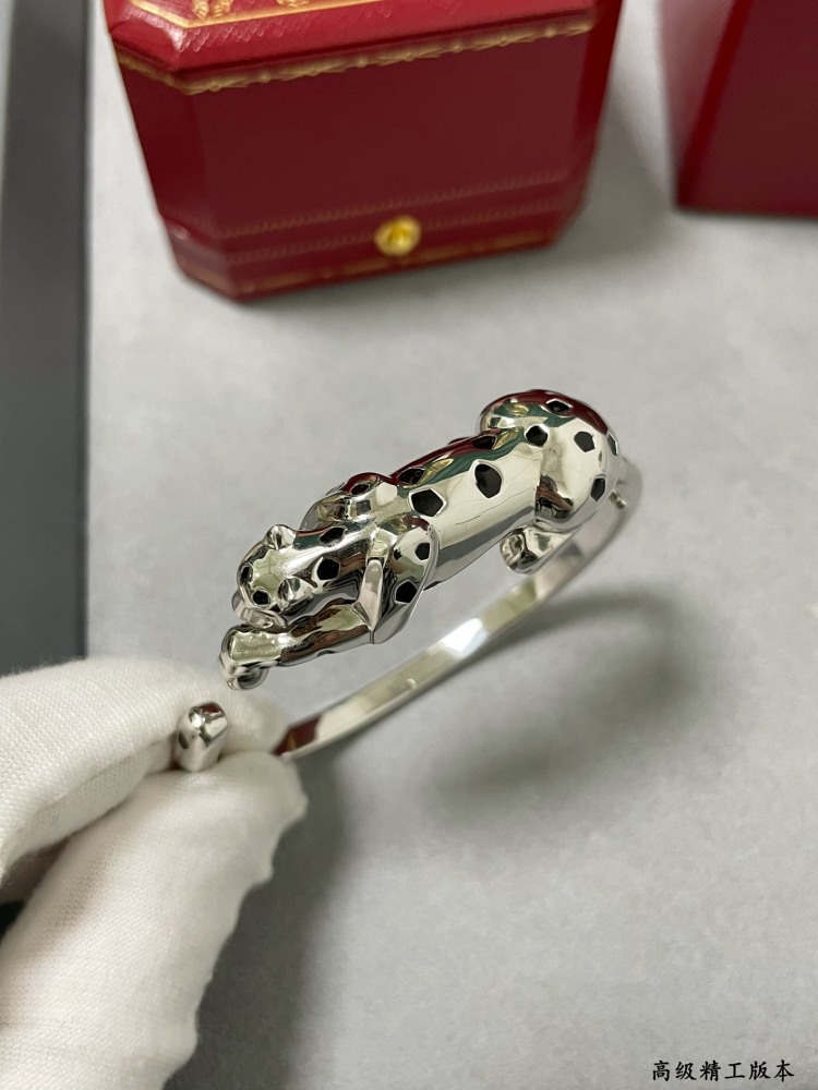 Cartier light gold spotted leopard bracelet.