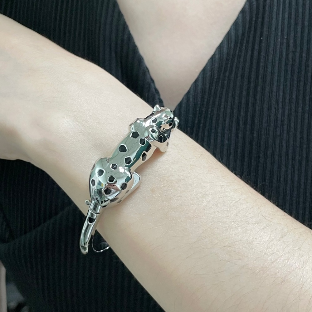 Cartier light gold spotted leopard bracelet.