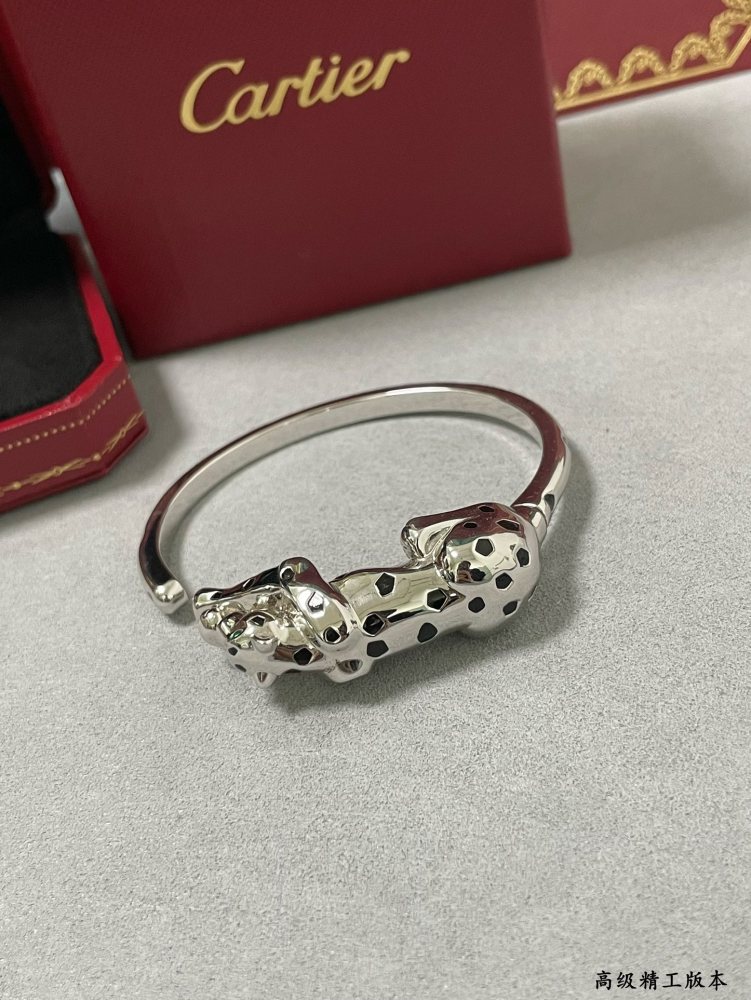 Cartier light gold spotted leopard bracelet.