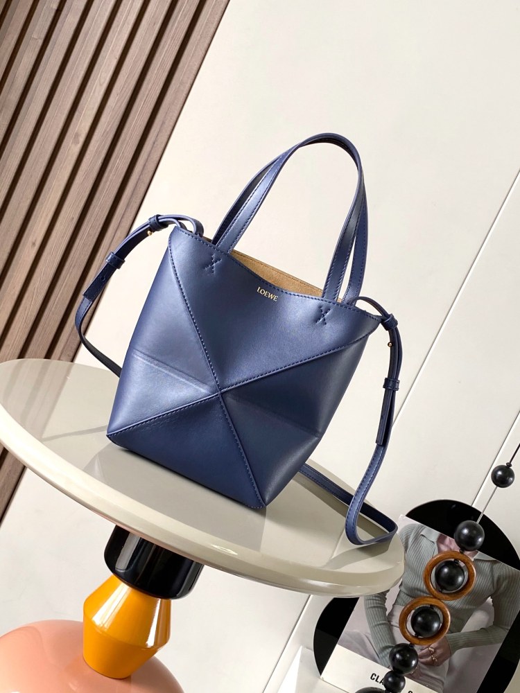 The new Puzzle Fold bag in shiny cowhide leather