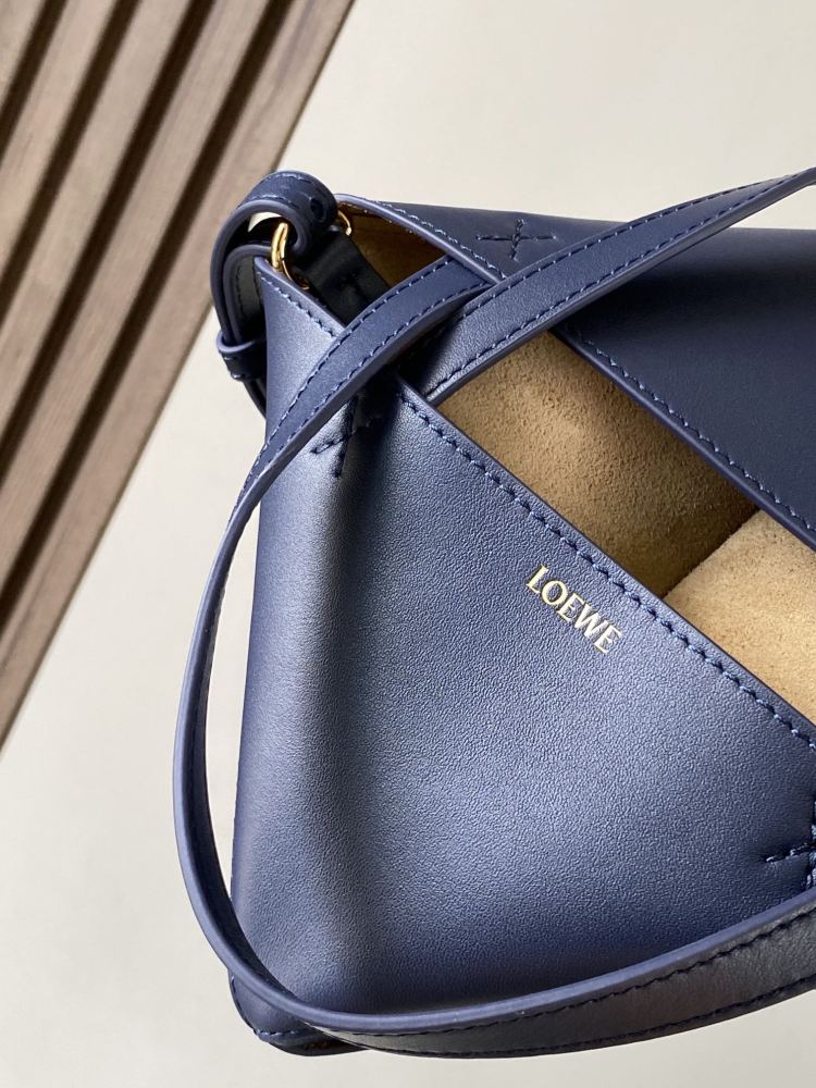 The new Puzzle Fold bag in shiny cowhide leather