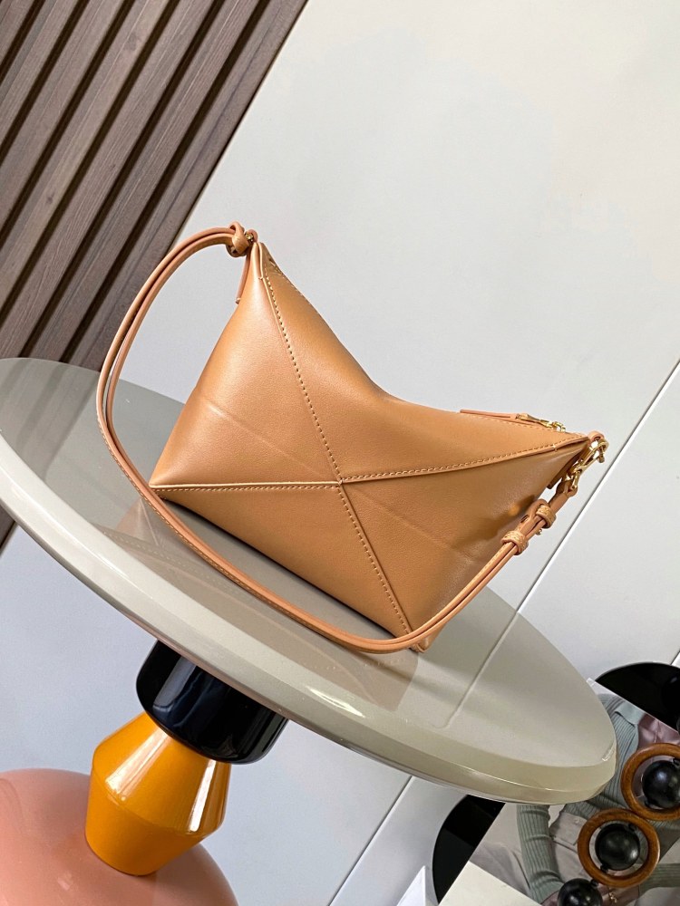New Puzzle Fold bag reinterpreted as a practical and versatile clutch bag.