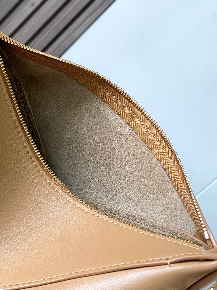 New Puzzle Fold bag reinterpreted as a practical and versatile clutch bag.