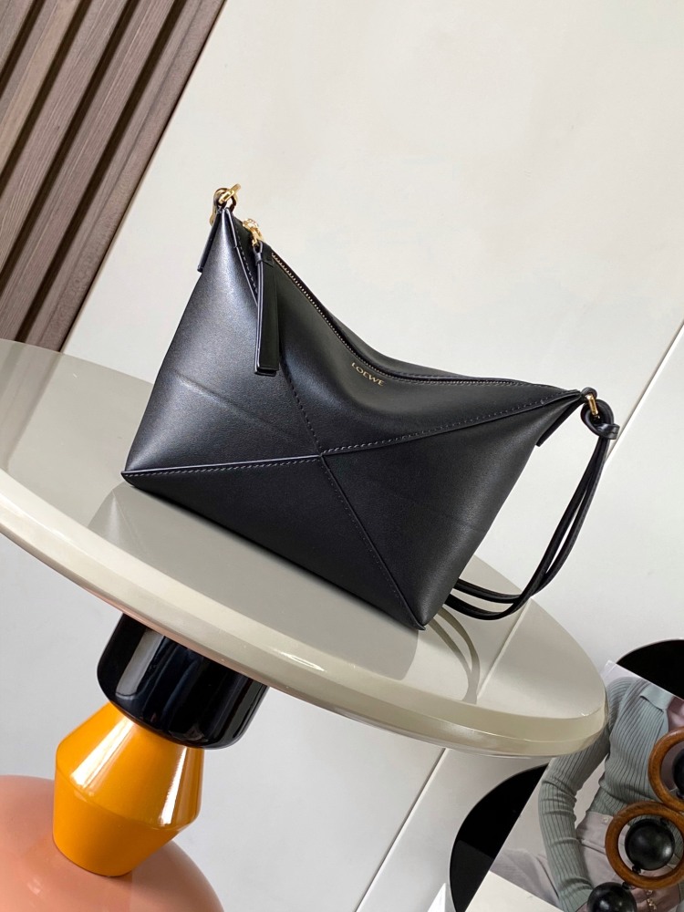 New Puzzle Fold bag reinterpreted as a practical and versatile clutch bag.