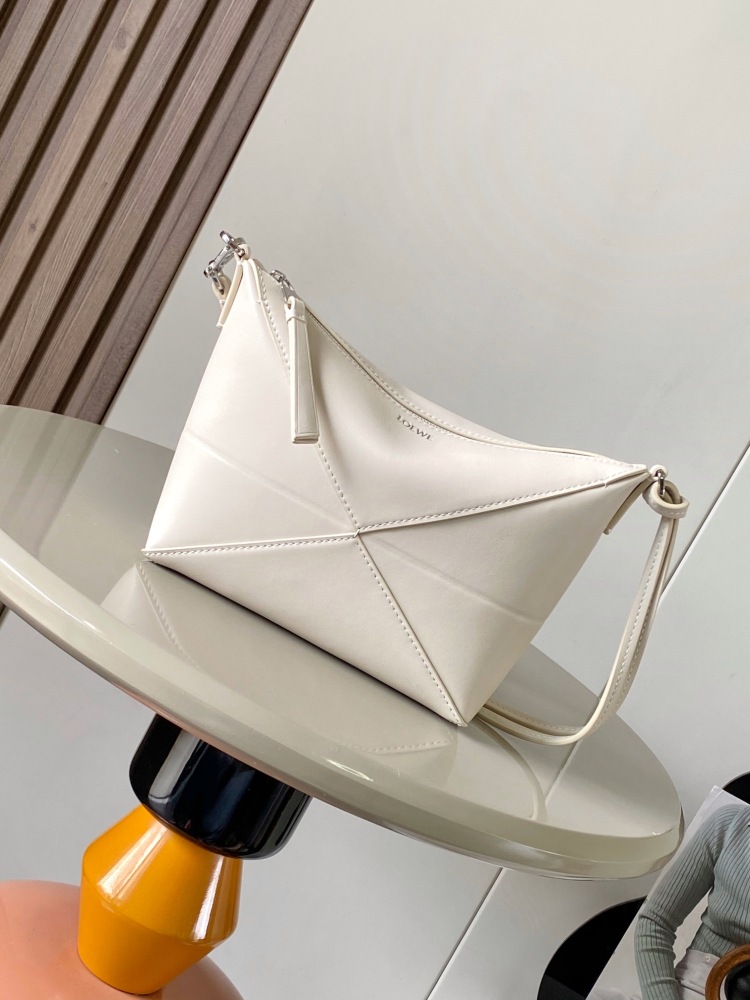 New Puzzle Fold bag reinterpreted as a practical and versatile clutch bag.