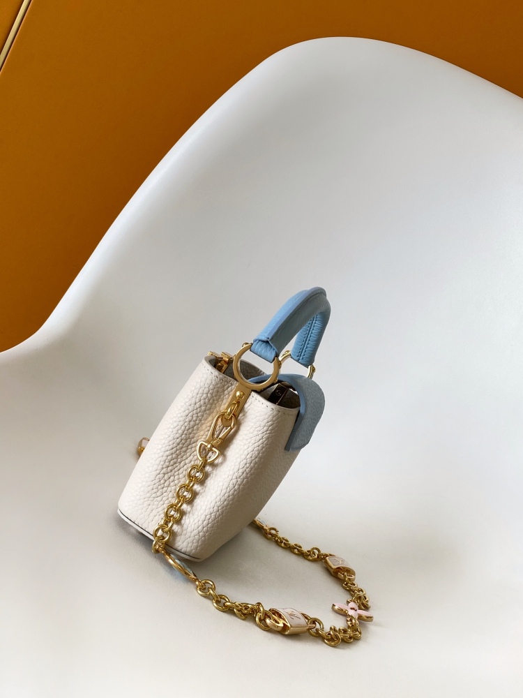 This Capucines mini bag is made of Taurillon leather with a gorgeous Lovelock chain.