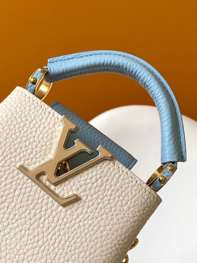 This Capucines mini bag is made of Taurillon leather with a gorgeous Lovelock chain.