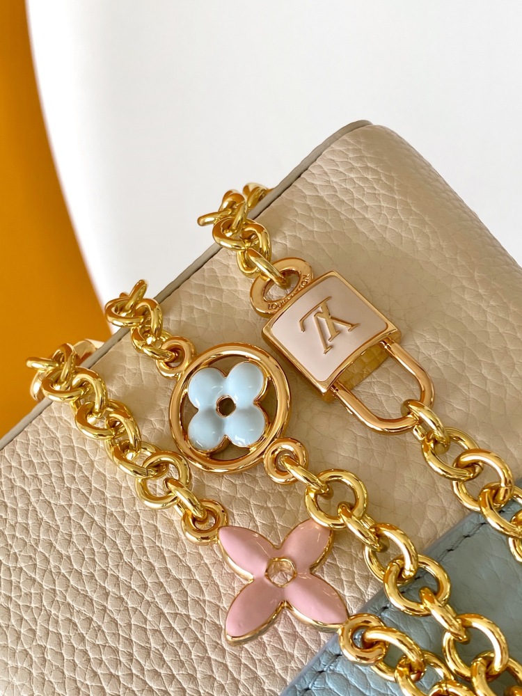 This Capucines mini bag is made of Taurillon leather with a gorgeous Lovelock chain.