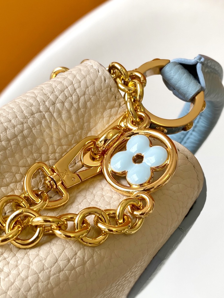 This Capucines mini bag is made of Taurillon leather with a gorgeous Lovelock chain.
